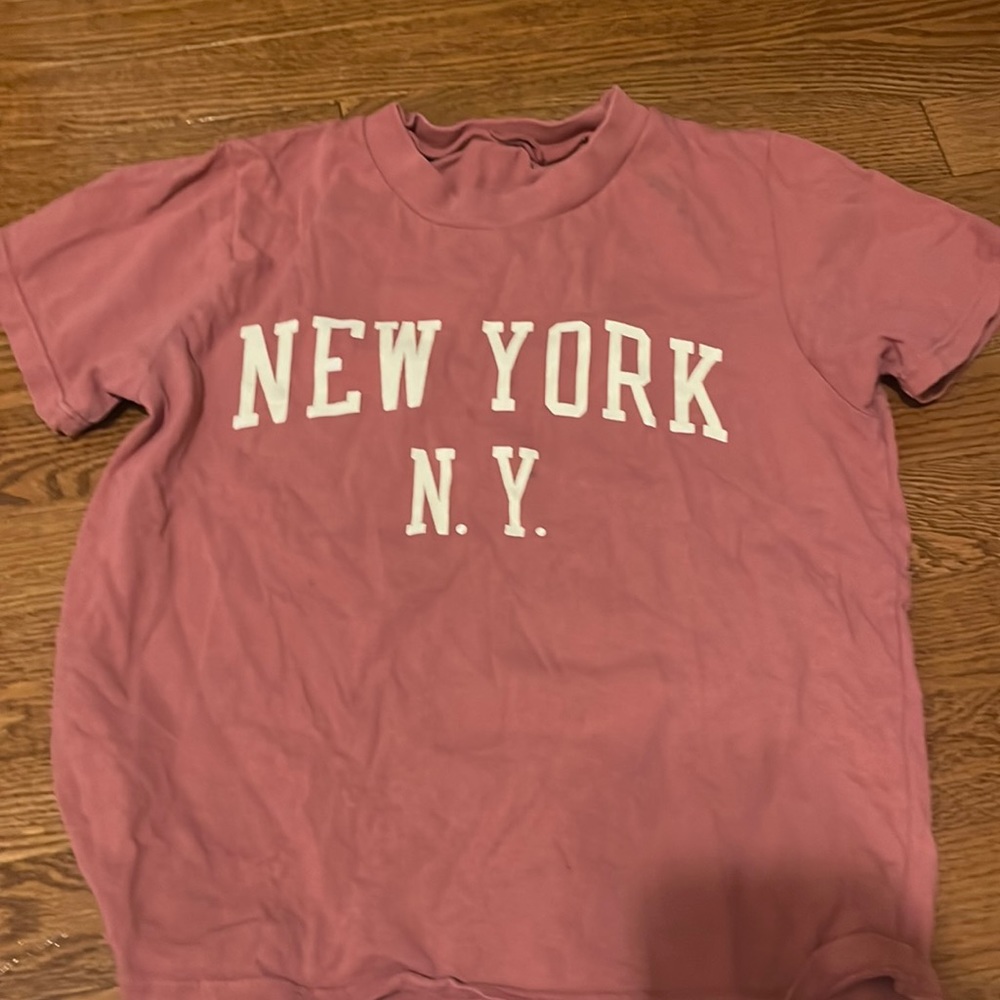 Brandy Melville. Looks to be a small or medium. This  specific shirt looks small